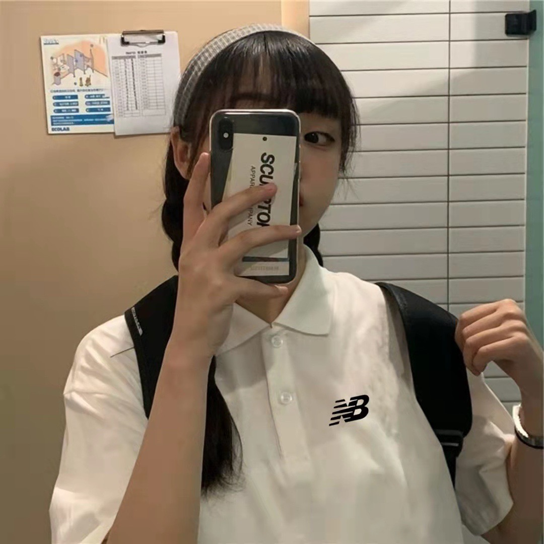 New Balance White Polo with Contrast Black Trim – Iconic 'NB' Emblem & Casual Backpack